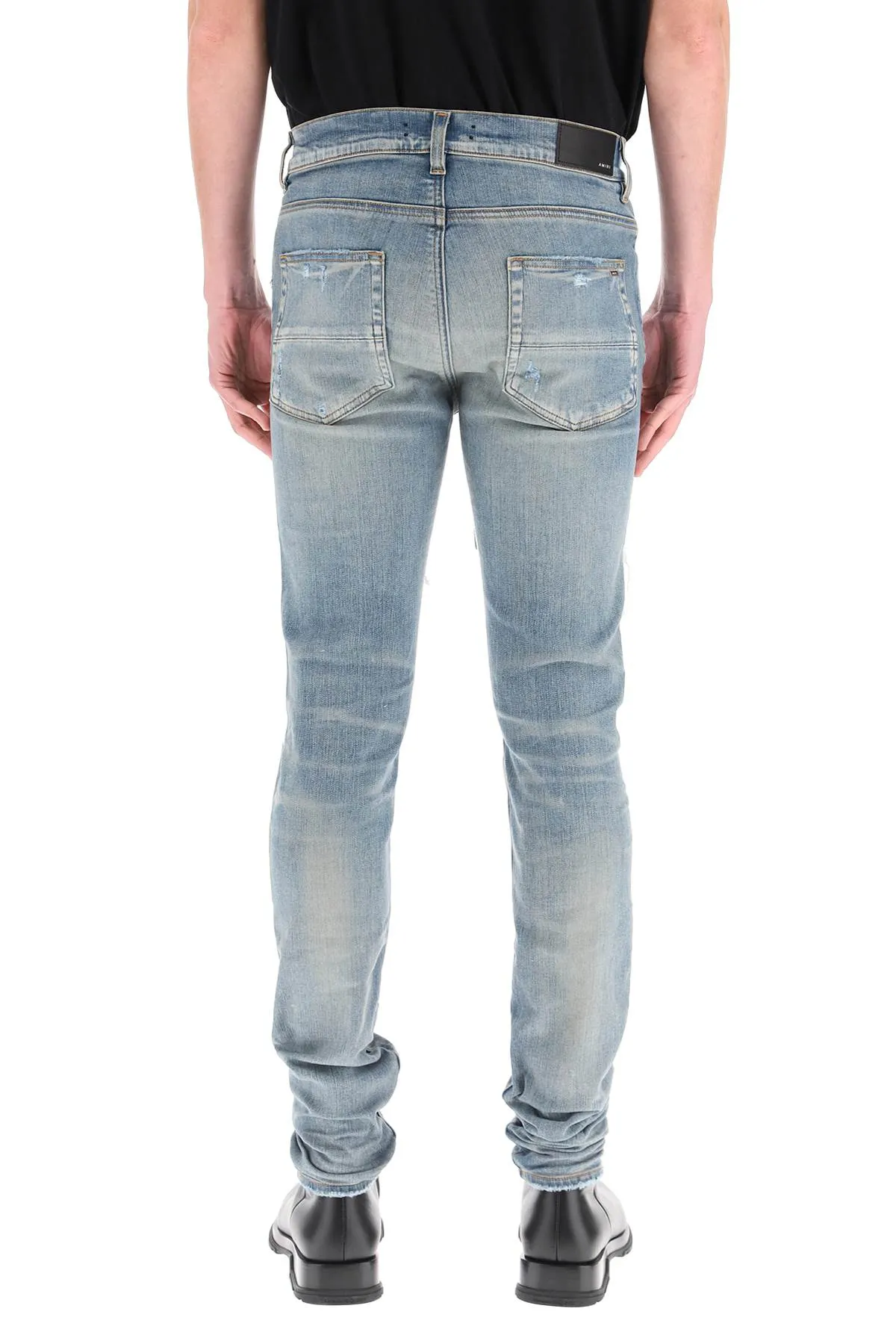 Amiri Logo Patch Ripped Slim Cut Jeans